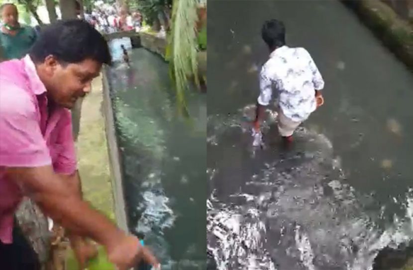 ড্রেনে টাকা কুড়াচ্ছে মানুষ!